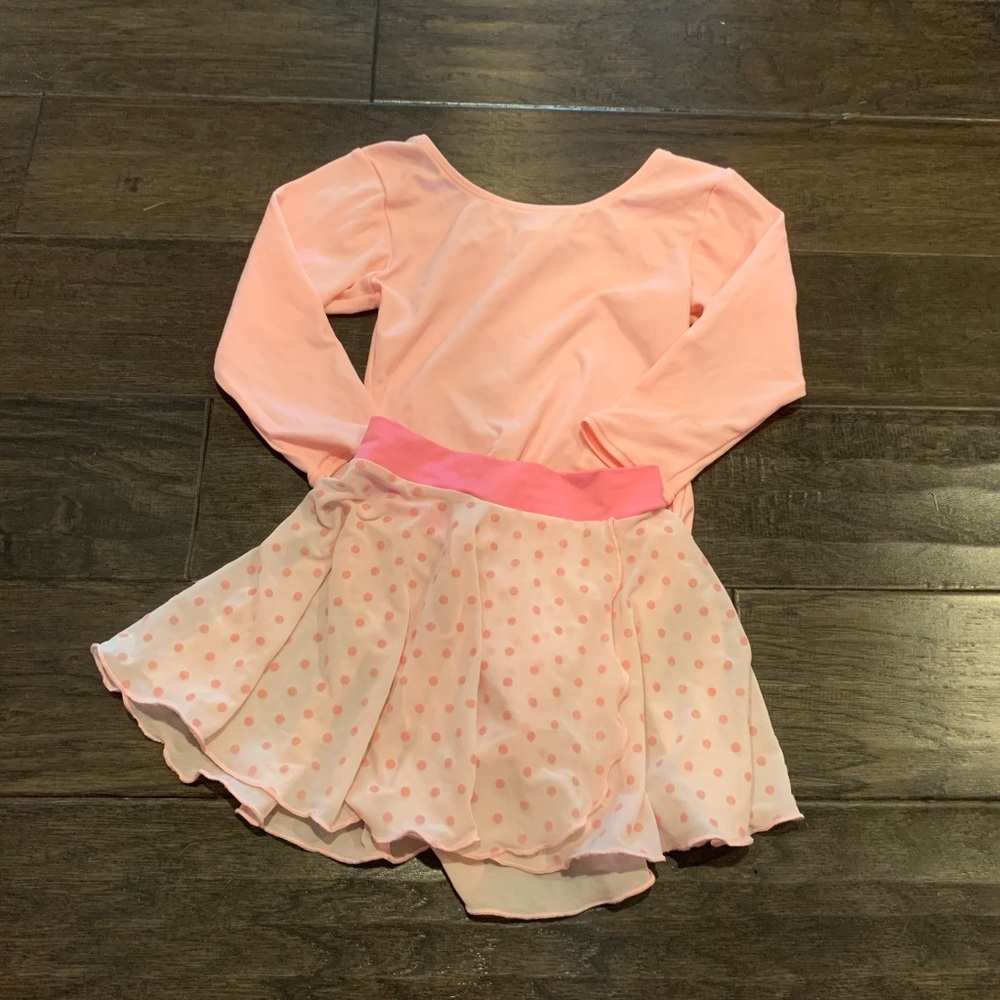 set of pink leotard and skirt